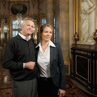 Visitors view the marble room in Solitude Palace